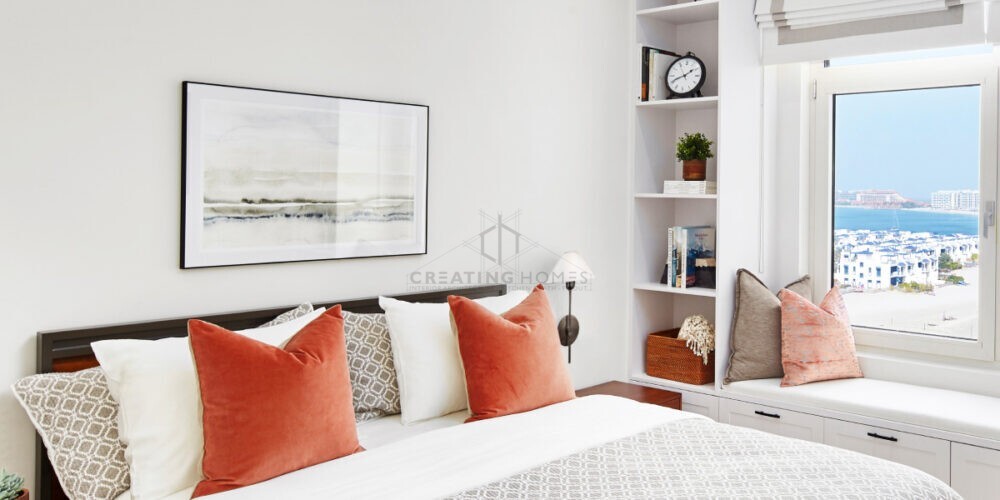 Creating Homes' stylish modern bedroom featuring a cozy bed, contemporary furnishings, and soft lighting, creating a warm and inviting atmosphere.